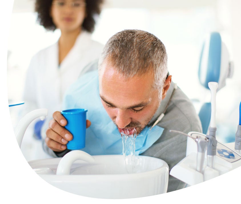 man on dentist