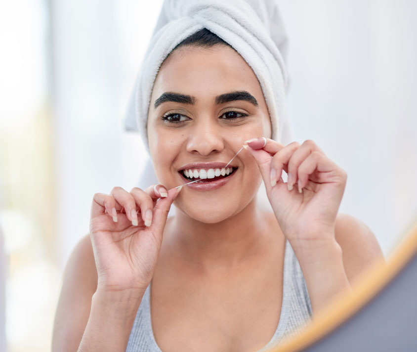 How do I use dental floss correctly?